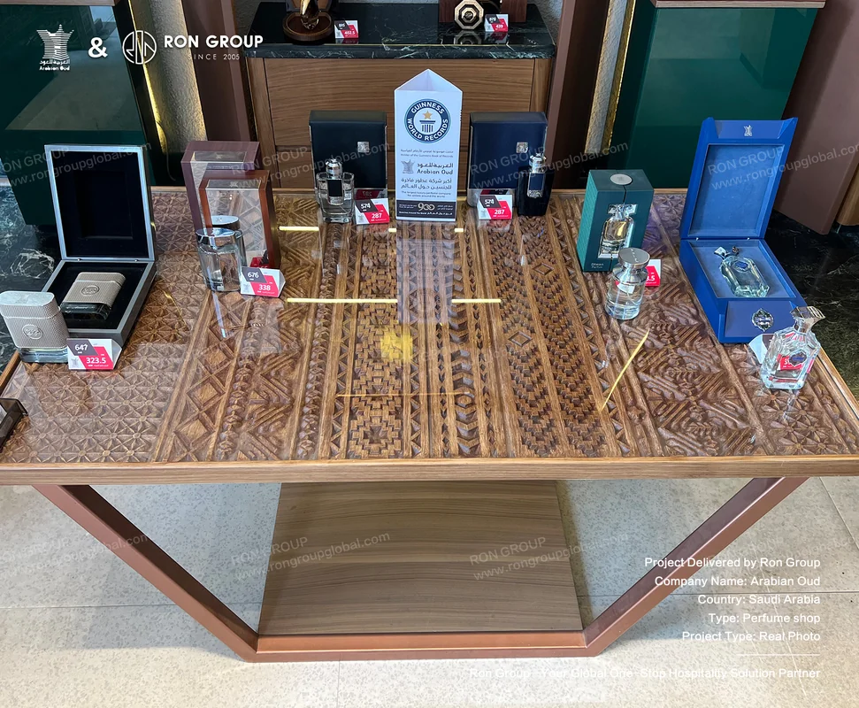 Glass Display Table Custom glass-top display table with metal framing for premium fragrance gift sets