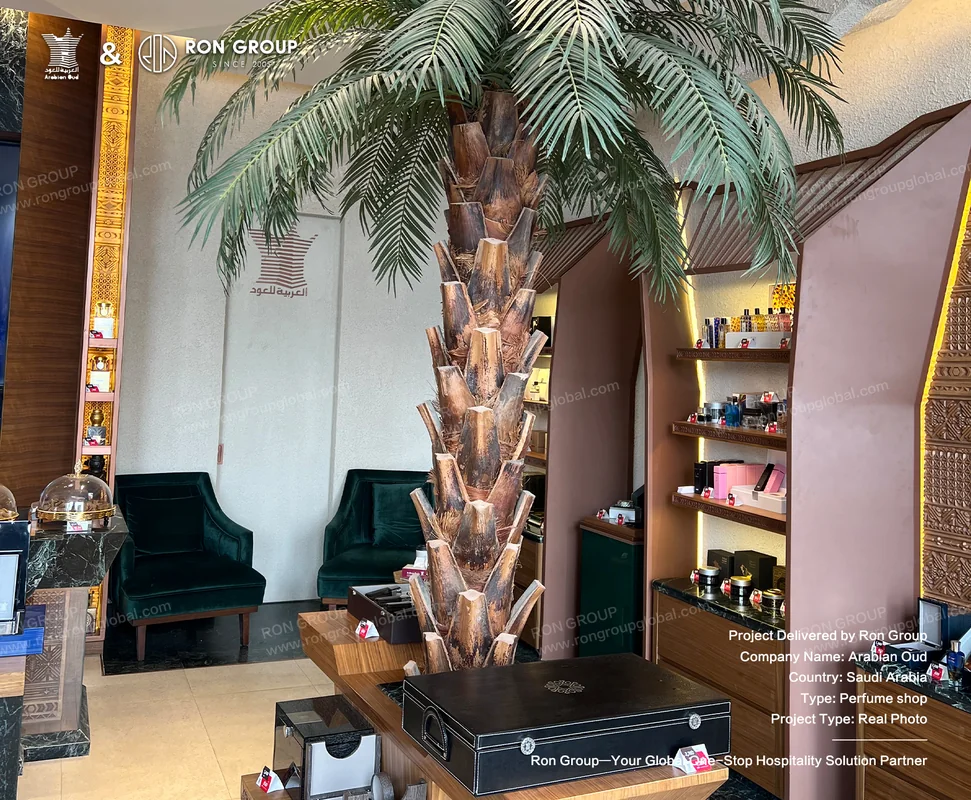 Signature Palm Tree Centerpiece Custom palm tree installation as the visual anchor of Arabian Oud retail interior