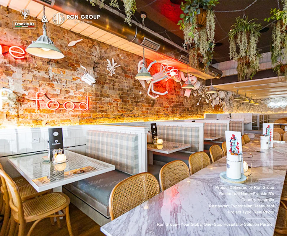 Exposed brick wall interior at Frankie B's with custom dining setup