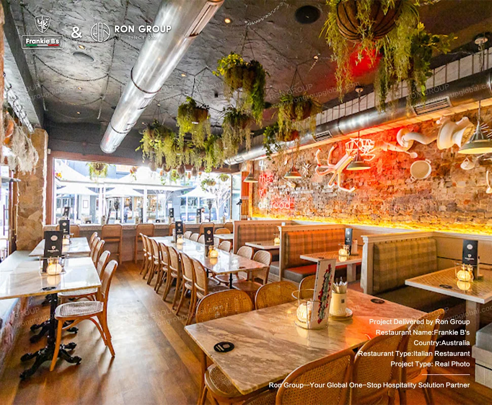 Industrial-style restaurant interior at Frankie B's featuring custom furniture
