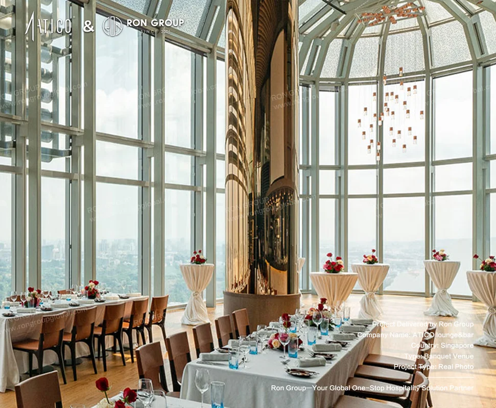 ATICO modern highrise banquet space with glass walls city views set tables and golden column