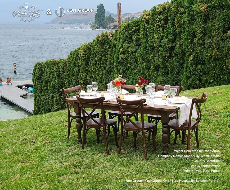 Amber Lilly Event Rentals outdoor wedding dining setup by the water