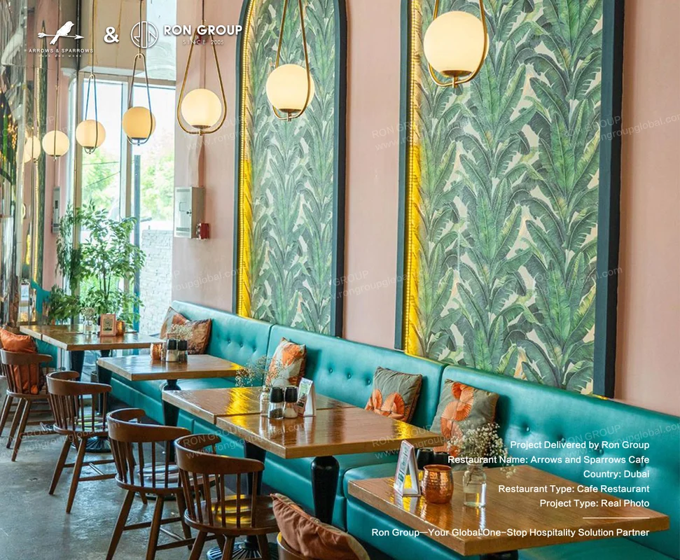 Arrows and Sparrows Cafe tropical leaf wallpaper teal booths