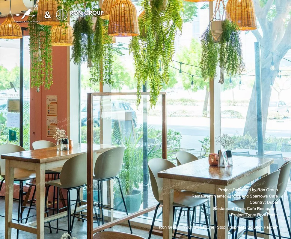 Arrows and Sparrows Cafe wooden tables greenery