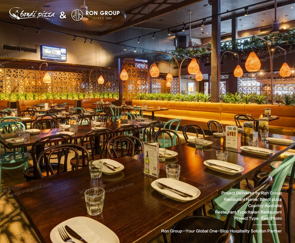 Bondi Pizza warm interior dining zone with tables and chairs