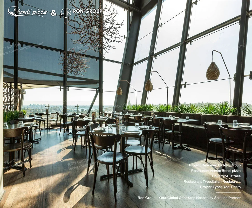 Bondi Pizza high-ceiling dining area with city views