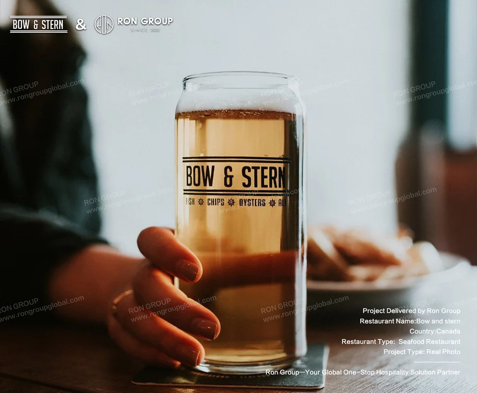 Bow and Stern branded beer glass with fish chips oysters ale text