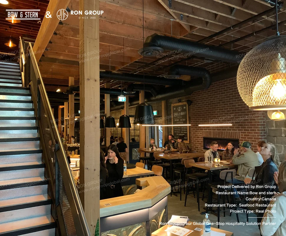 Bow and Stern industrial seafood restaurant interior with wood beams
