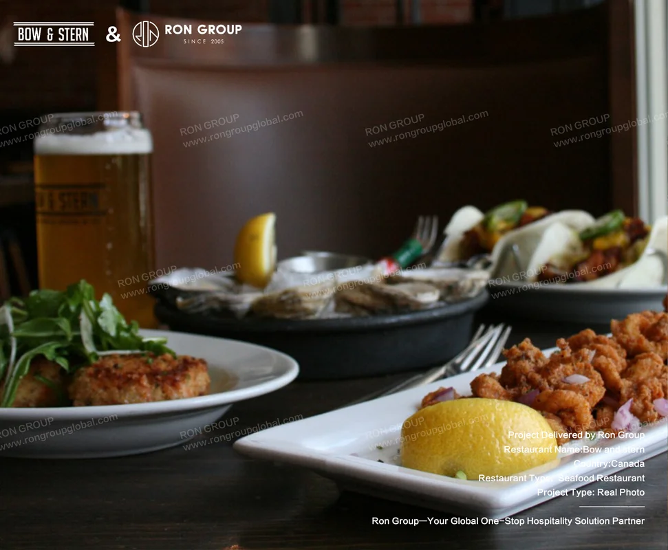 Bow and Stern seafood dishes and beer on wooden table