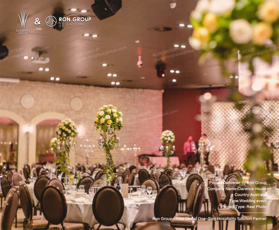 Clarence House wedding reception hall with floral centerpieces and warm lighting