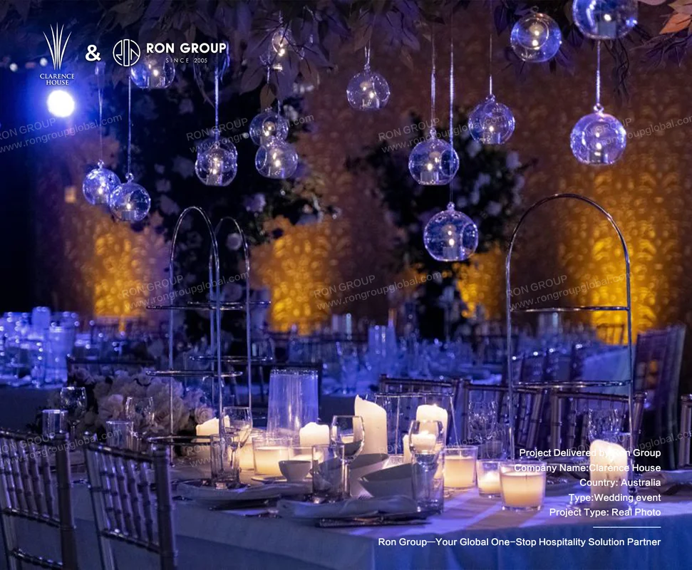 Clarence House elegant wedding table setting with candles and glass orbs