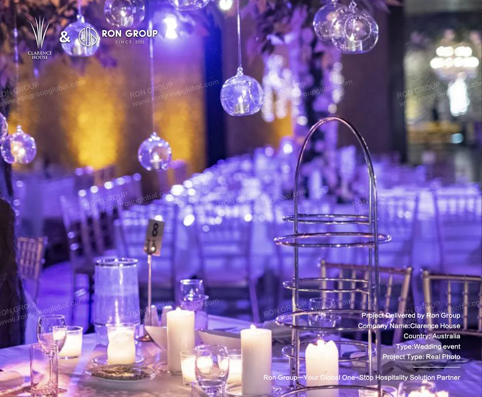 Clarence House wedding table setup with purple lighting and crystal orbs