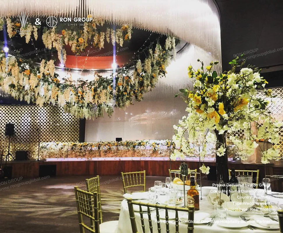 Clarence House elegant wedding venue setup with floral canopy and gold backdrop