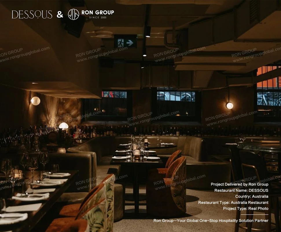 DESSOUS dimly lit restaurant interior with wine display