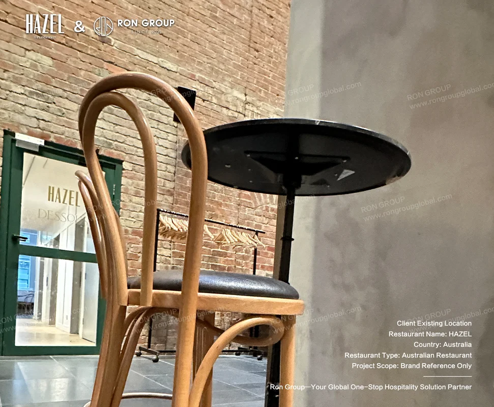 Wooden chair and black table detail