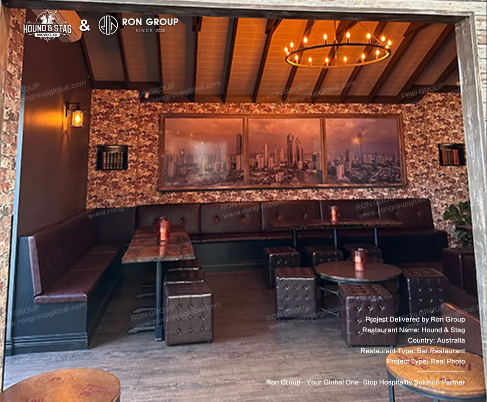 Hound Stag warm wooden ceiling interior with dark leather booths rustic tables and tufted stools