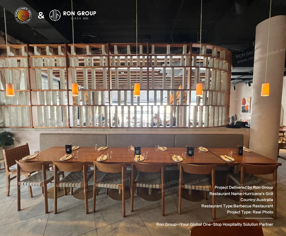Long timber table with curved wooden slat partition