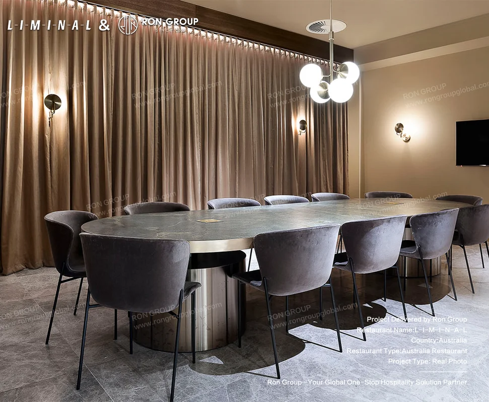 Refined dining room with marble table and dark chairs