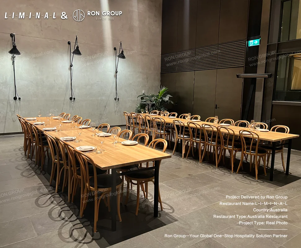 Long wooden tables and wooden chairs in dining area