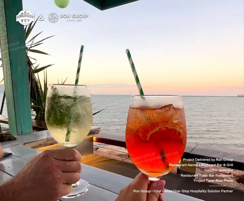 Longboard Bar & Grill RonGroup-Longboard_Bar_Grill-Two_Cocktails_By_The_Sea.webp