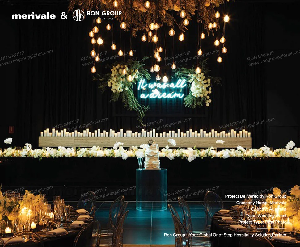 Merivale dark wedding backdrop with neon sign and candles