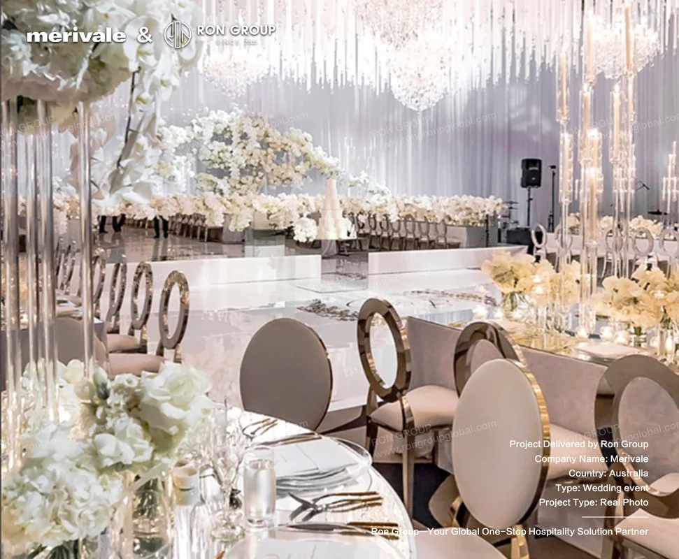 Merivale wedding reception with white floral centerpieces and chandeliers