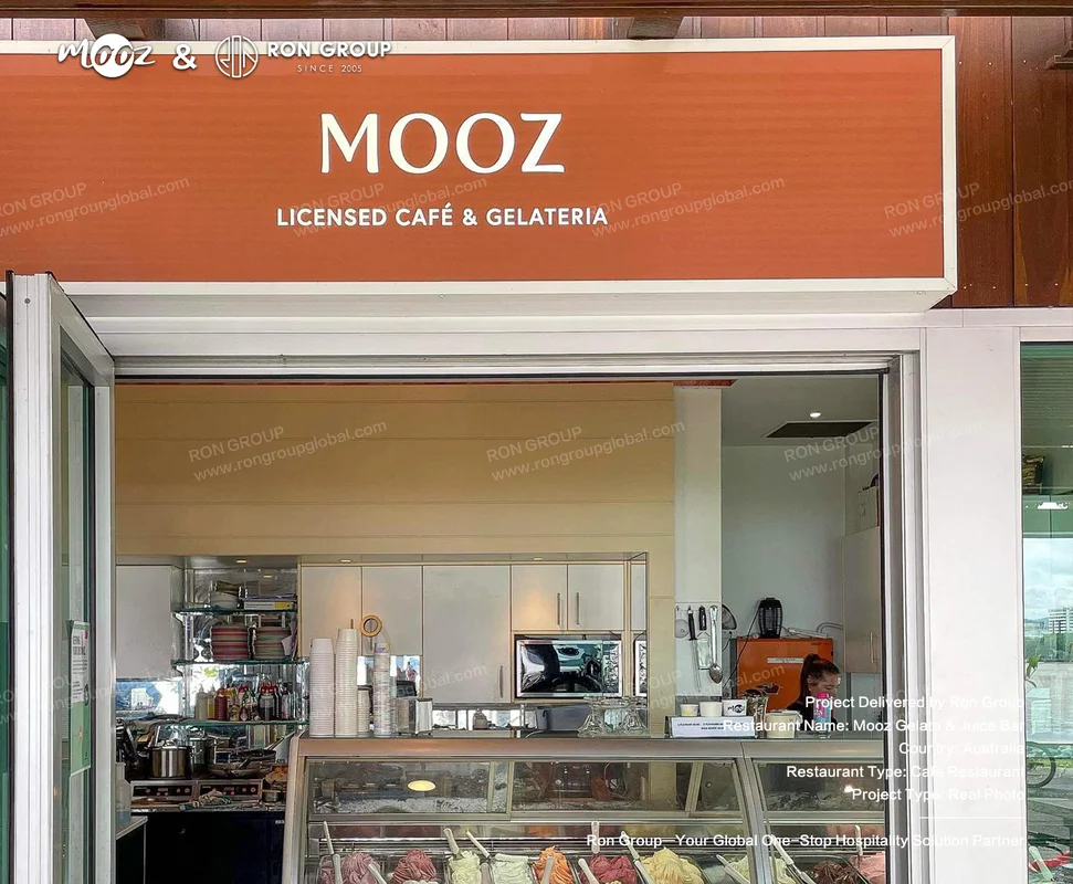 Mooz Gelato and Juice Bar cafe storefront with orange sign