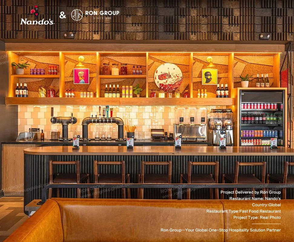 Nando's modern restaurant bar area with stools condiment shelves and beverage equipment