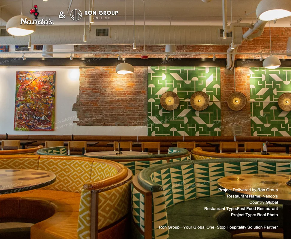 Nando's patterned booth seating with brick walls and pendant lights