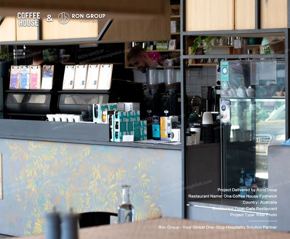 Ona Coffee House Fyshwick RonGroup-Ona_Coffee_House_Fyshwick-Cafe_Counter_With_Floral_Wall.webp