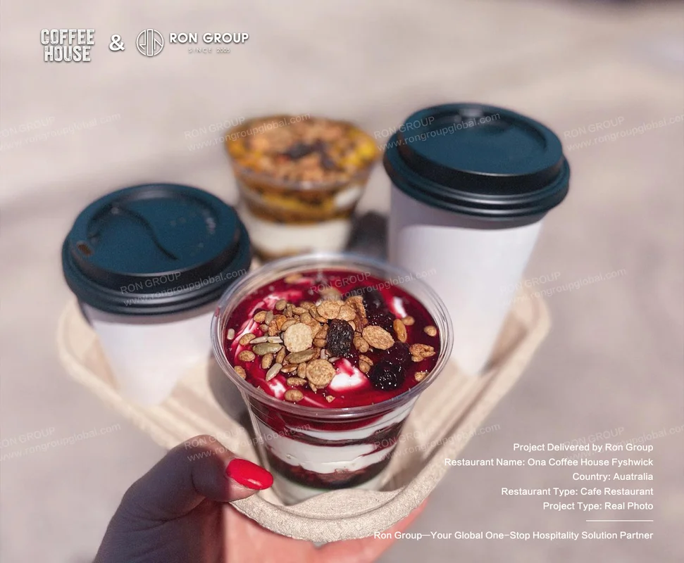 Ona Coffee House Fyshwick RonGroup-Ona_Coffee_House_Fyshwick-Hand_Holding_Tray_With_Drinks.webp