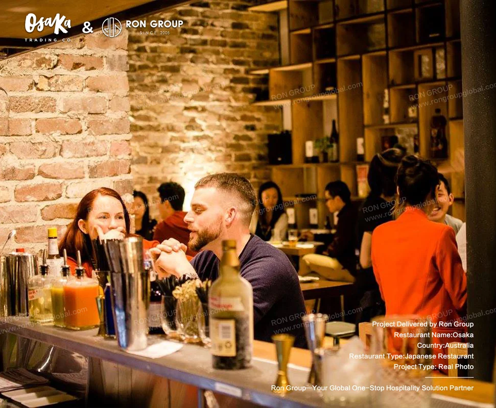 Bar area with exposed brick and patrons conversing