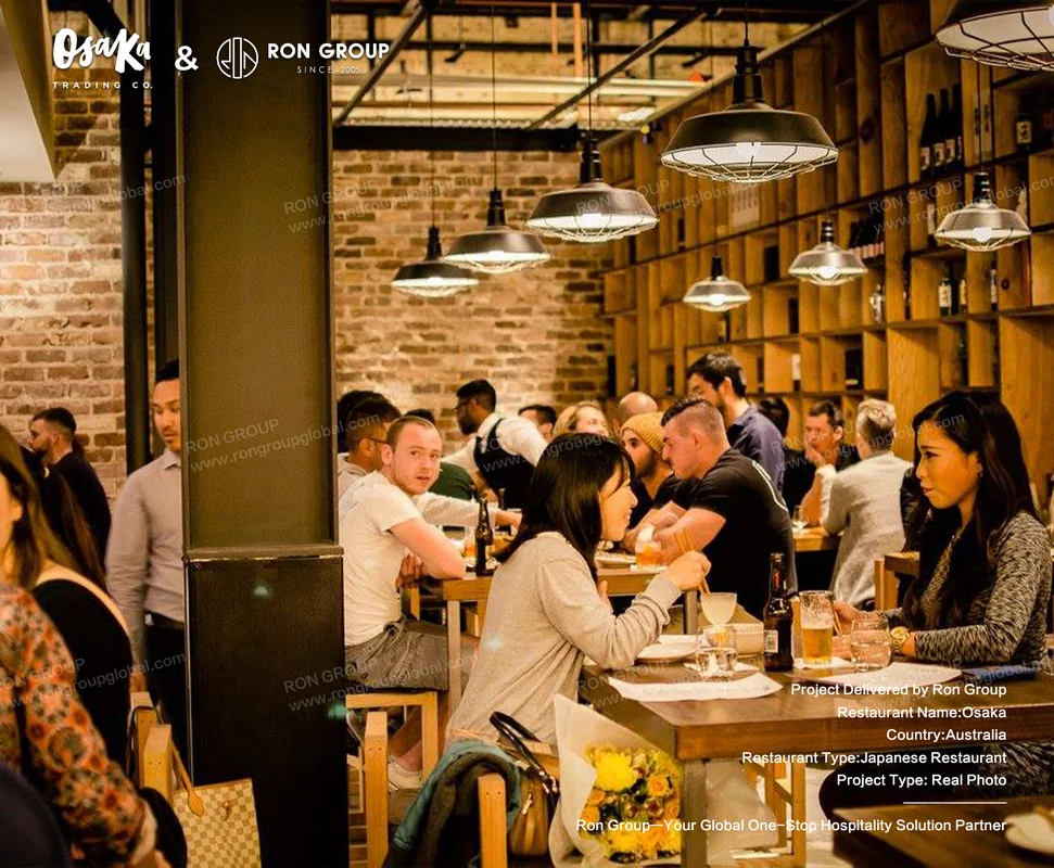 Busy restaurant with exposed brick and industrial lighting