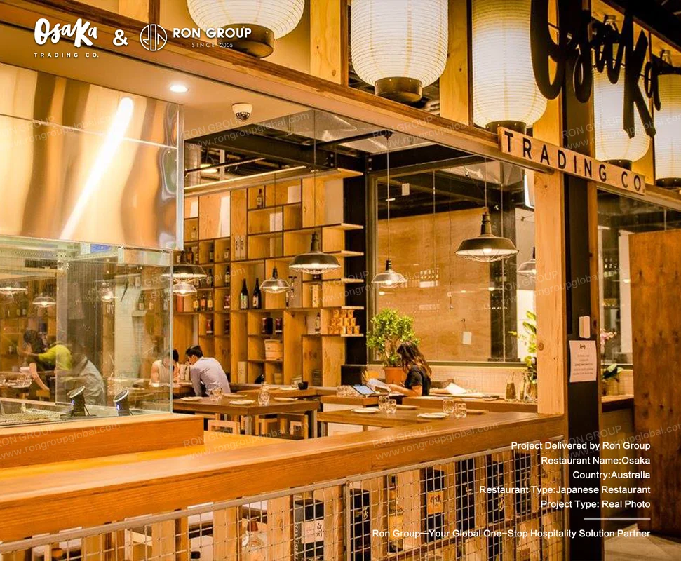 Wooden interior with paper lanterns and visible kitchen