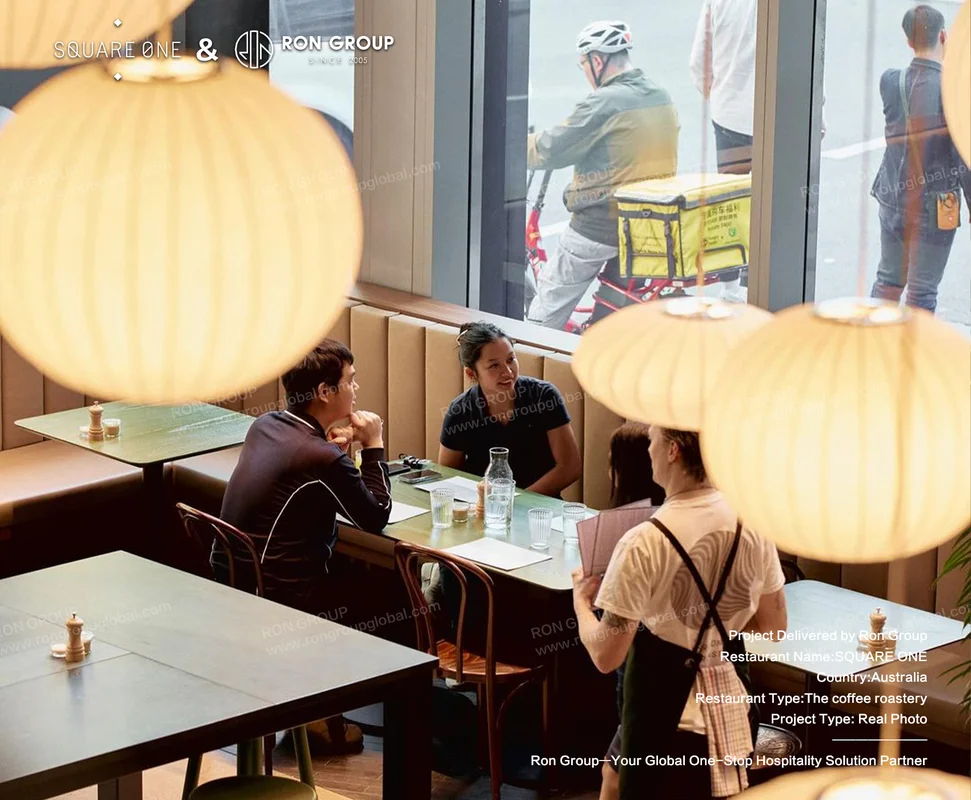 SQUARE ONE cozy cafe interior with lanterns and street view