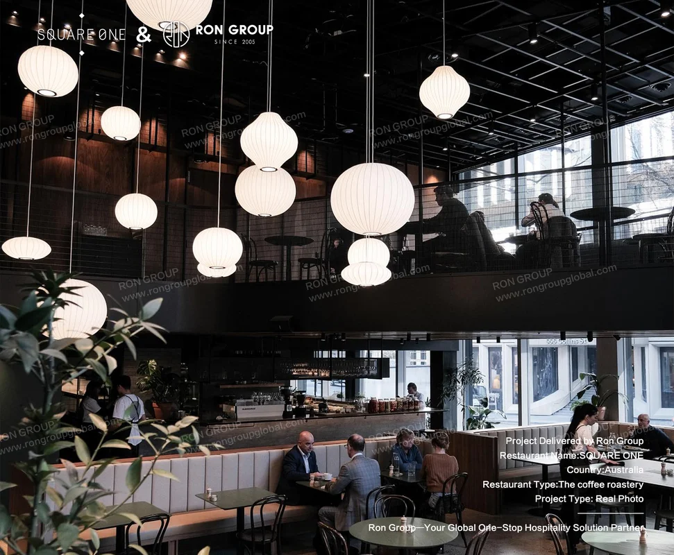 SQUARE ONE seating area with paper lanterns and mezzanine view