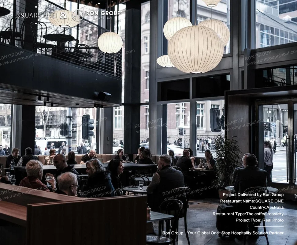 SQUARE ONE bright cafe interior with timber booths and pendant lights