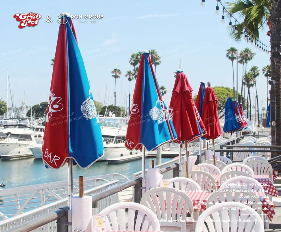 The Crab Pot waterfront patio seating with umbrellas and marina view