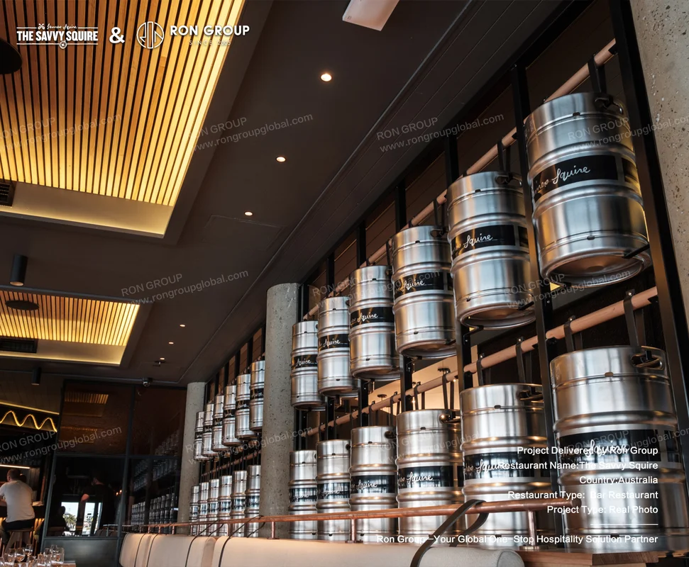 Stainless steel beer keg display wall with Squire branding