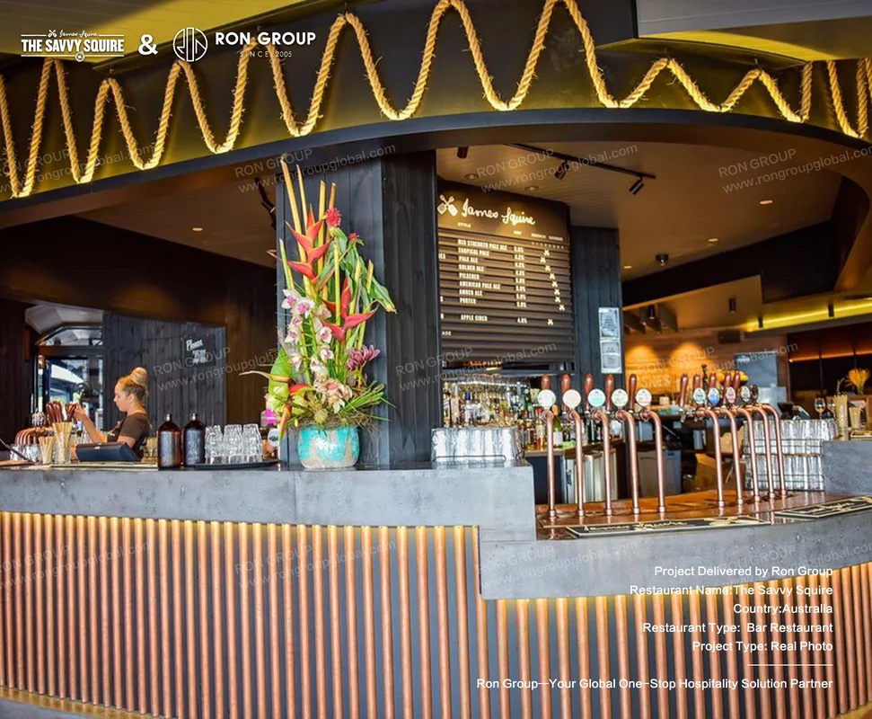 Copper-accented bar counter with craft beer taps