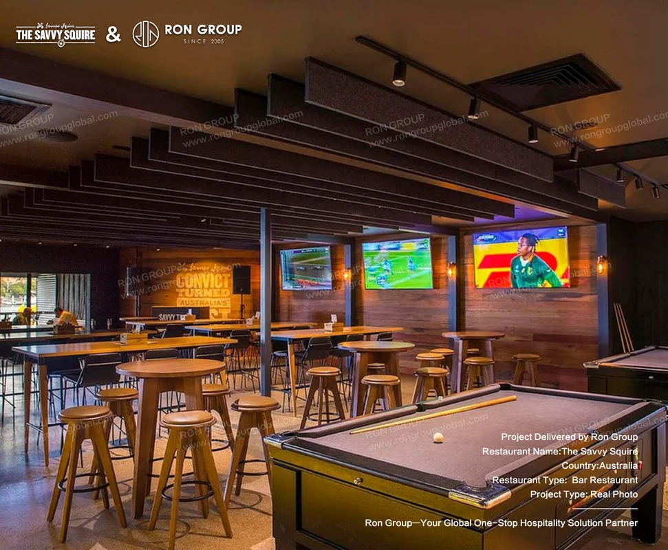 Pool table lounge with timber stools and sports screens