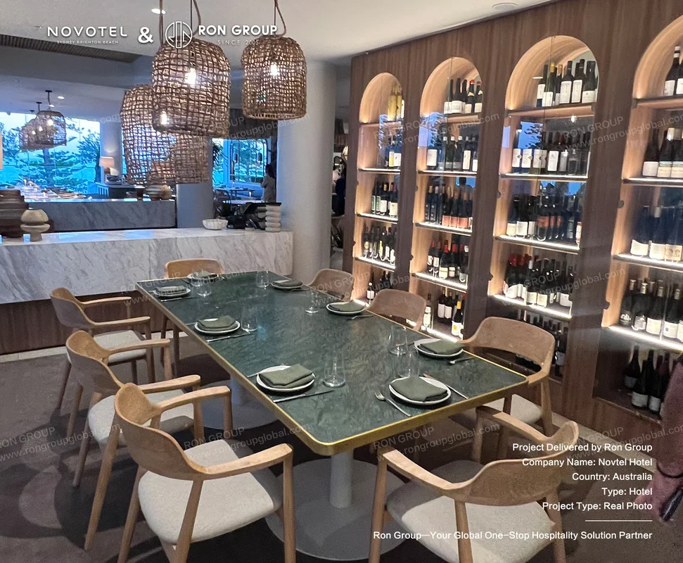 Green marble table with wooden dining chairs in hotel restaurant