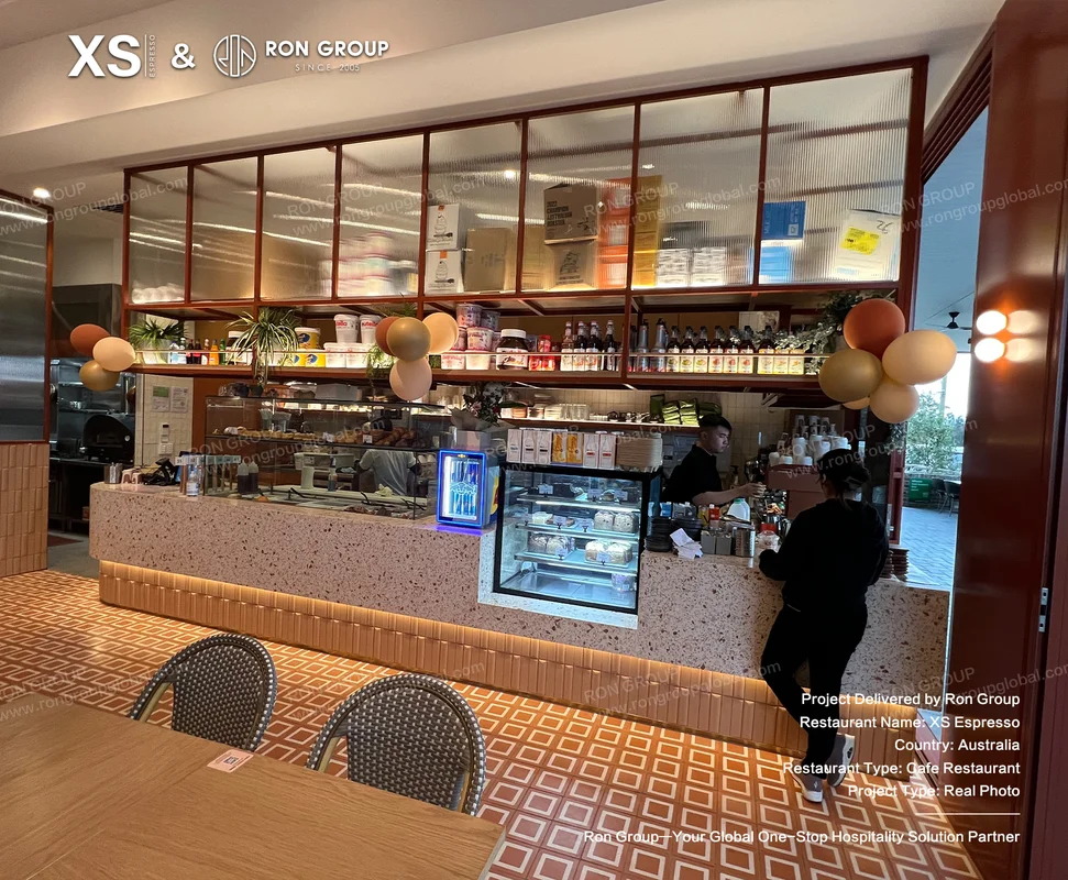 XS Espresso terrazzo counter and patterned floor in service area