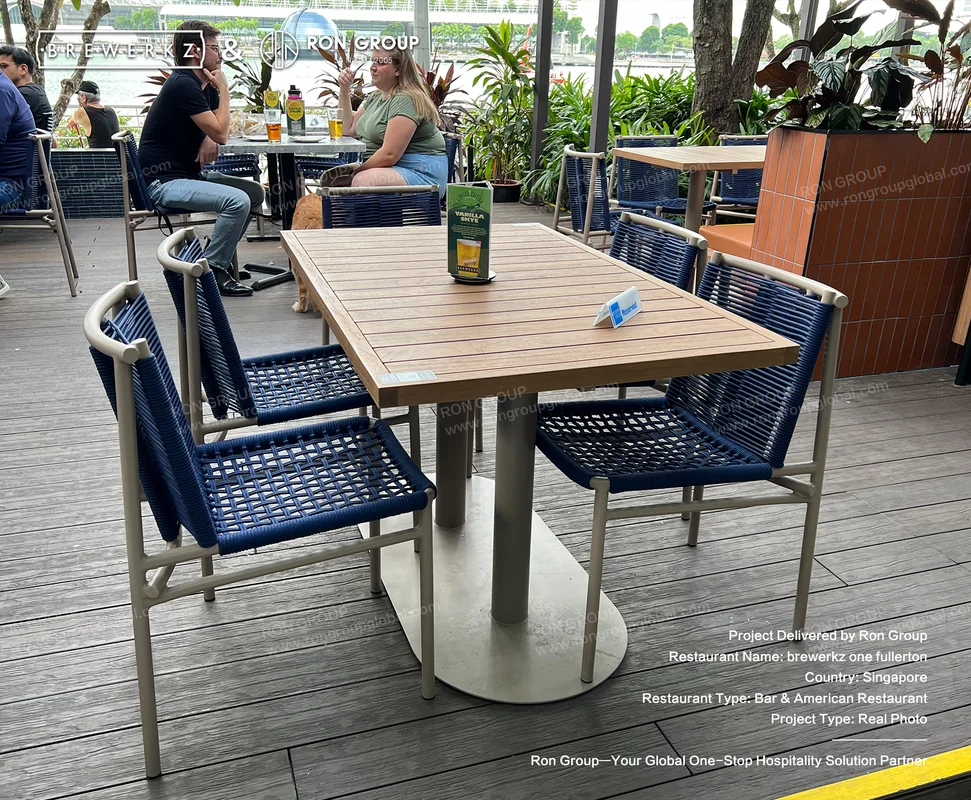 Brewerkz wooden deck seating by the water