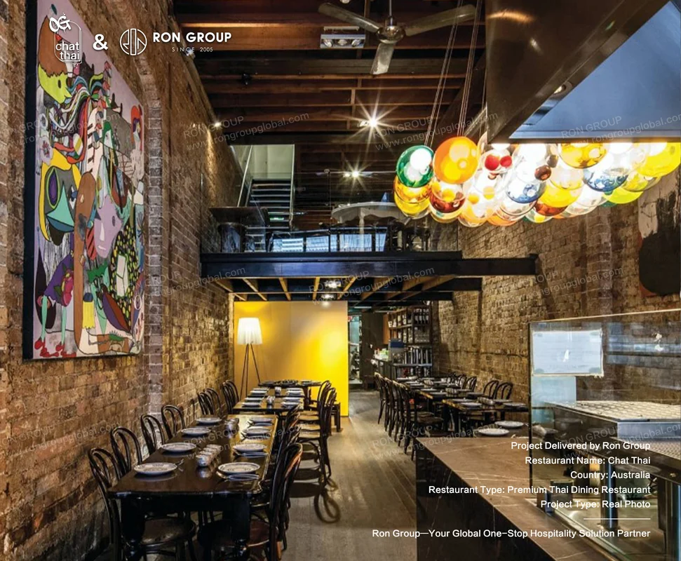 Chat Thai industrial interior with art and chandelier