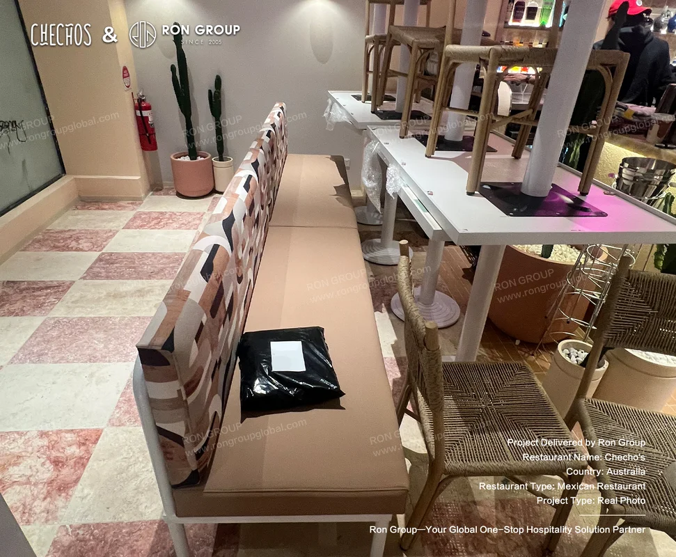 Checho's patterned bench and wicker chairs