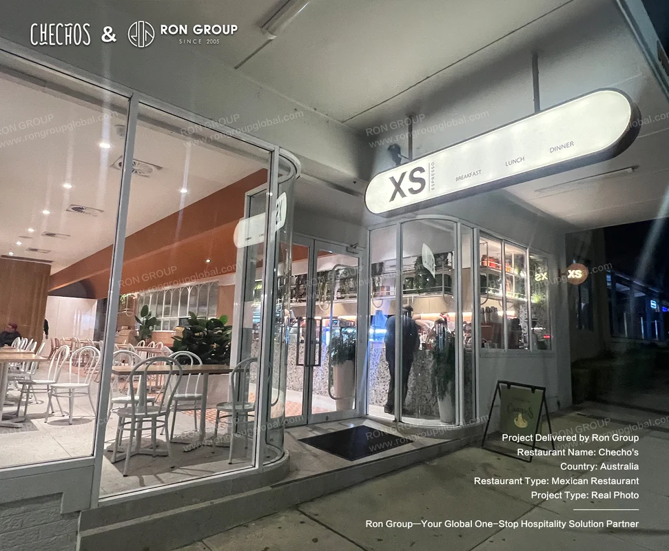 Checho's Cronulla storefront at night