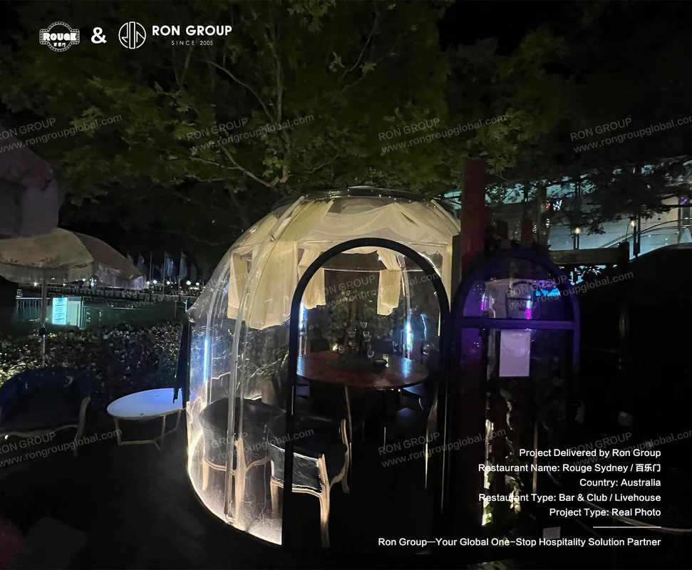 ROUGE outdoor dining pod at night