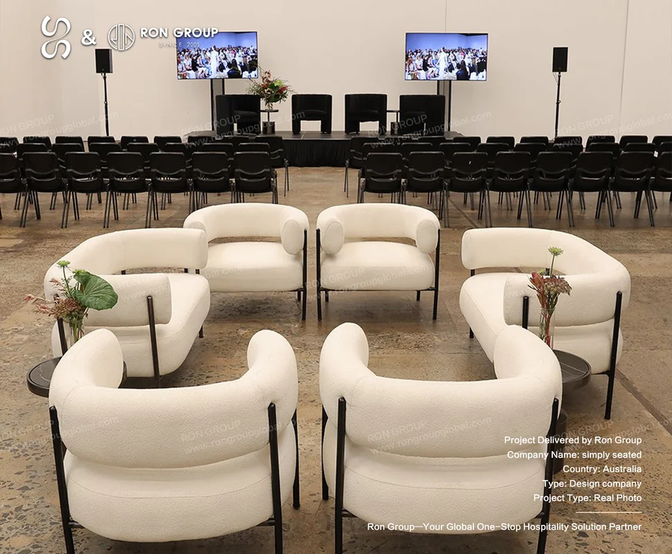 Simply Seated white lounge chairs facing a stage