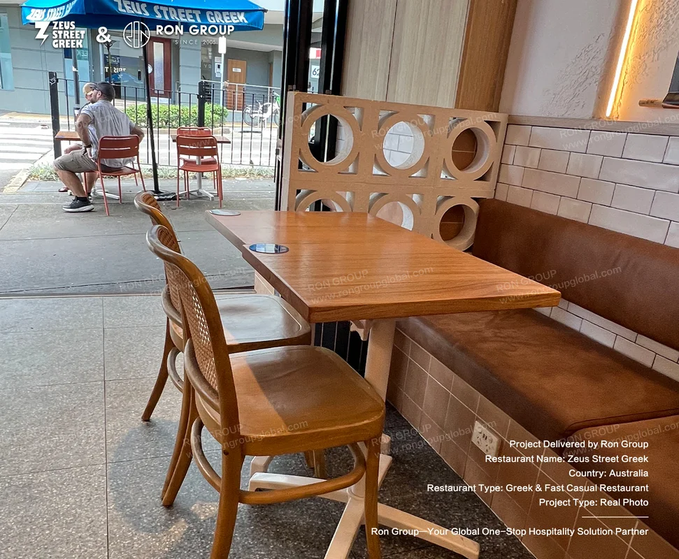 Zeus Street Greek outdoor seating with branded umbrella